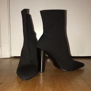 Enhance block heel sock boots in black knit